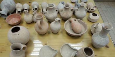 Some of the items seized, some antiquities and some forgeries. (Nir Distelfeld/Israel Antiquities Authority)